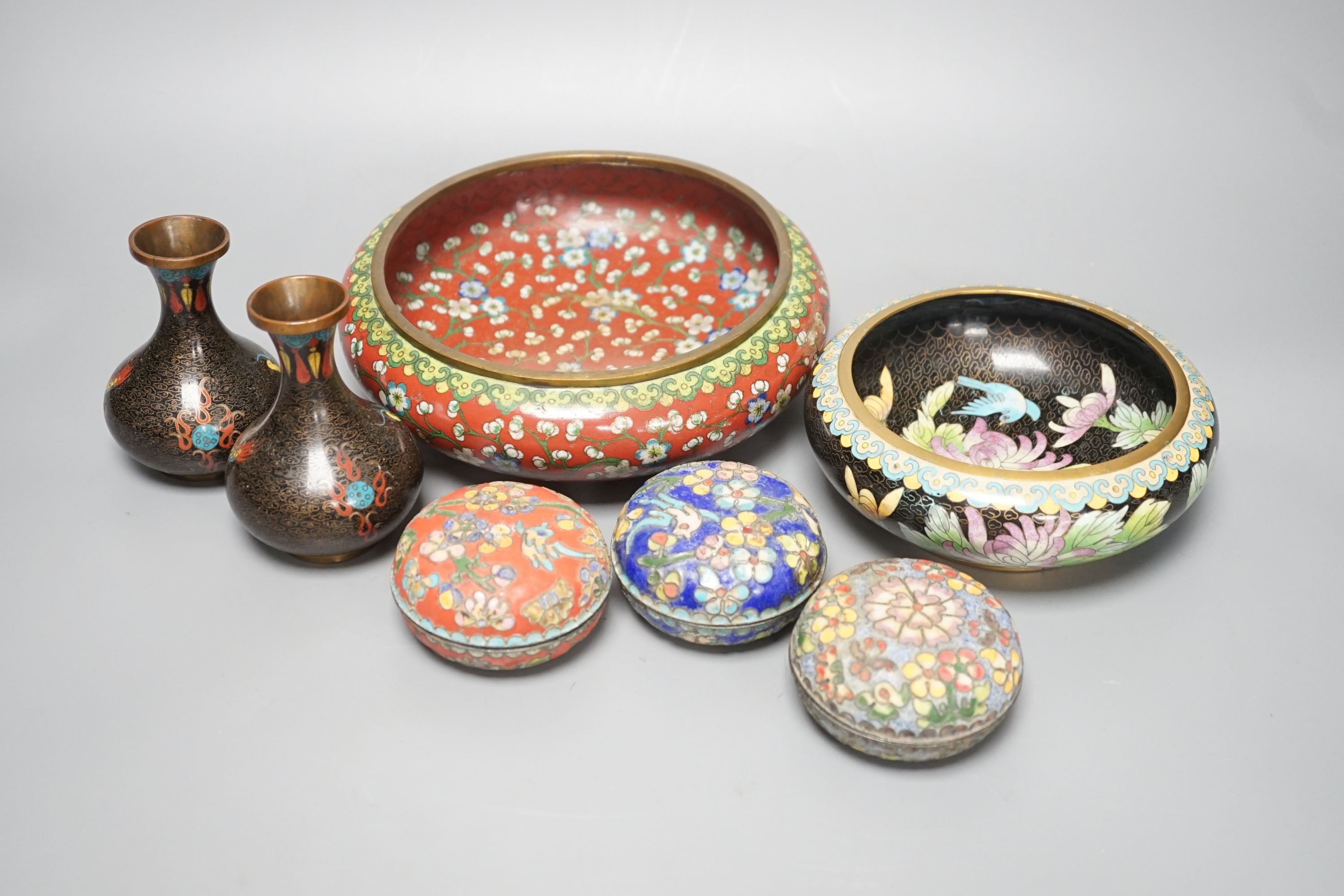 A group of Chinese cloisonné enamel dishes, boxes and a pair of vases, early 20th century and later, largest diameter 17cm